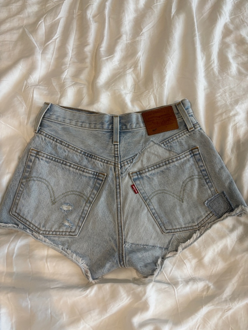 Levi's Light Wash Raw Hem Denim Shorts